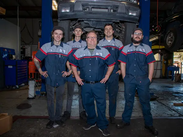 Team members at Master AutoTech