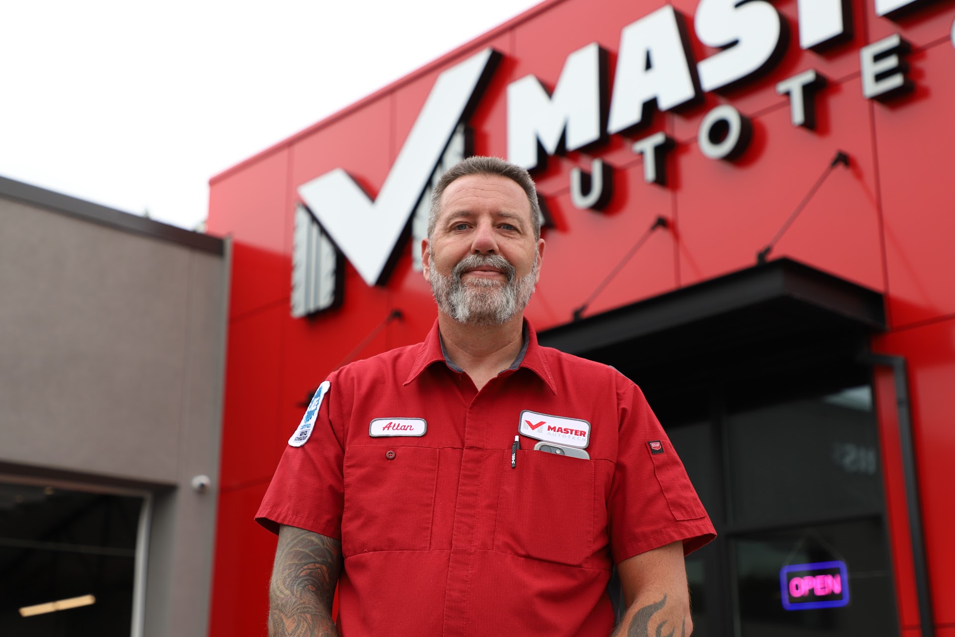 Allan Cantonwine outside rebranded Master AutoTech store