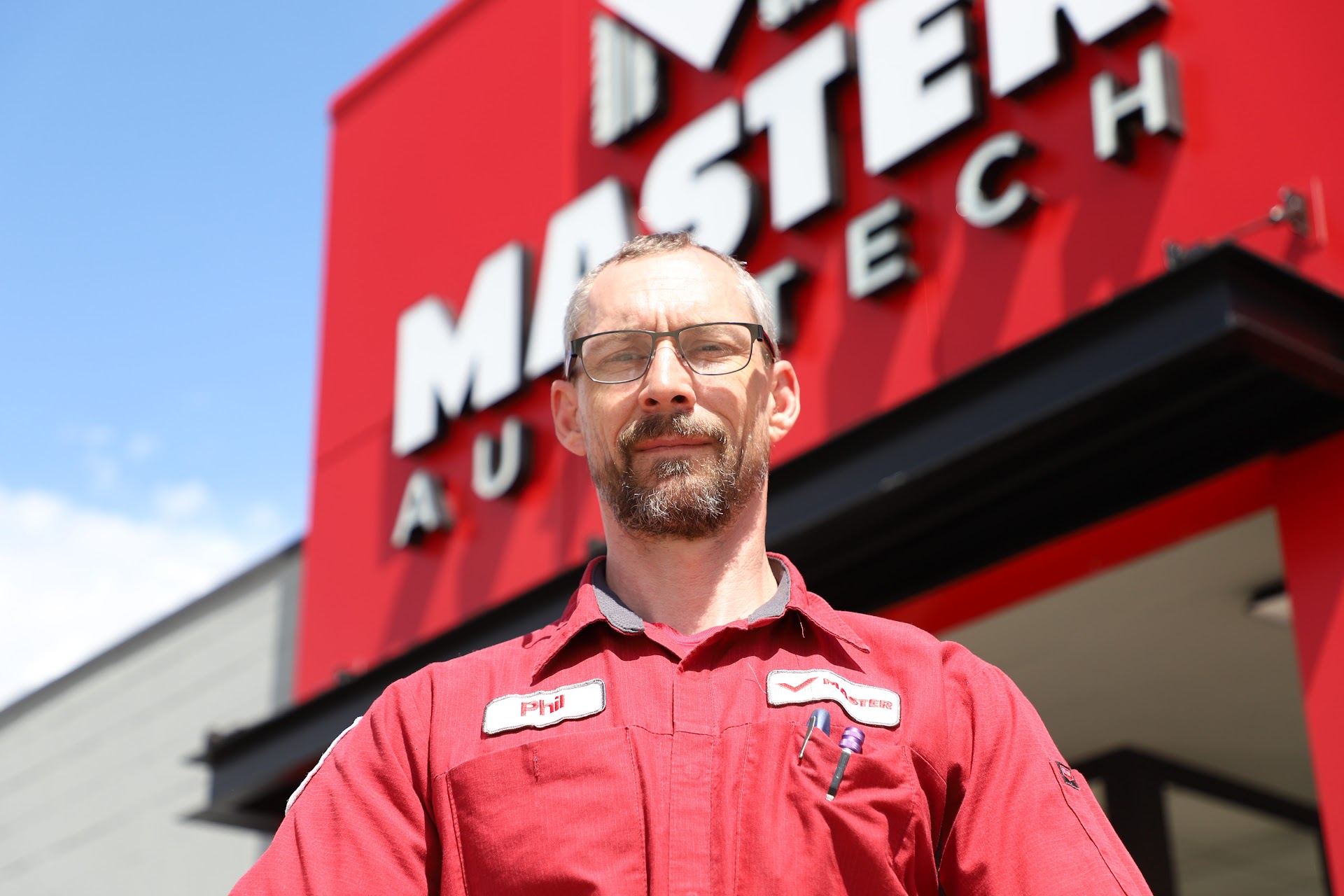 Phil Baillargeon outside rebranded Master AutoTech store